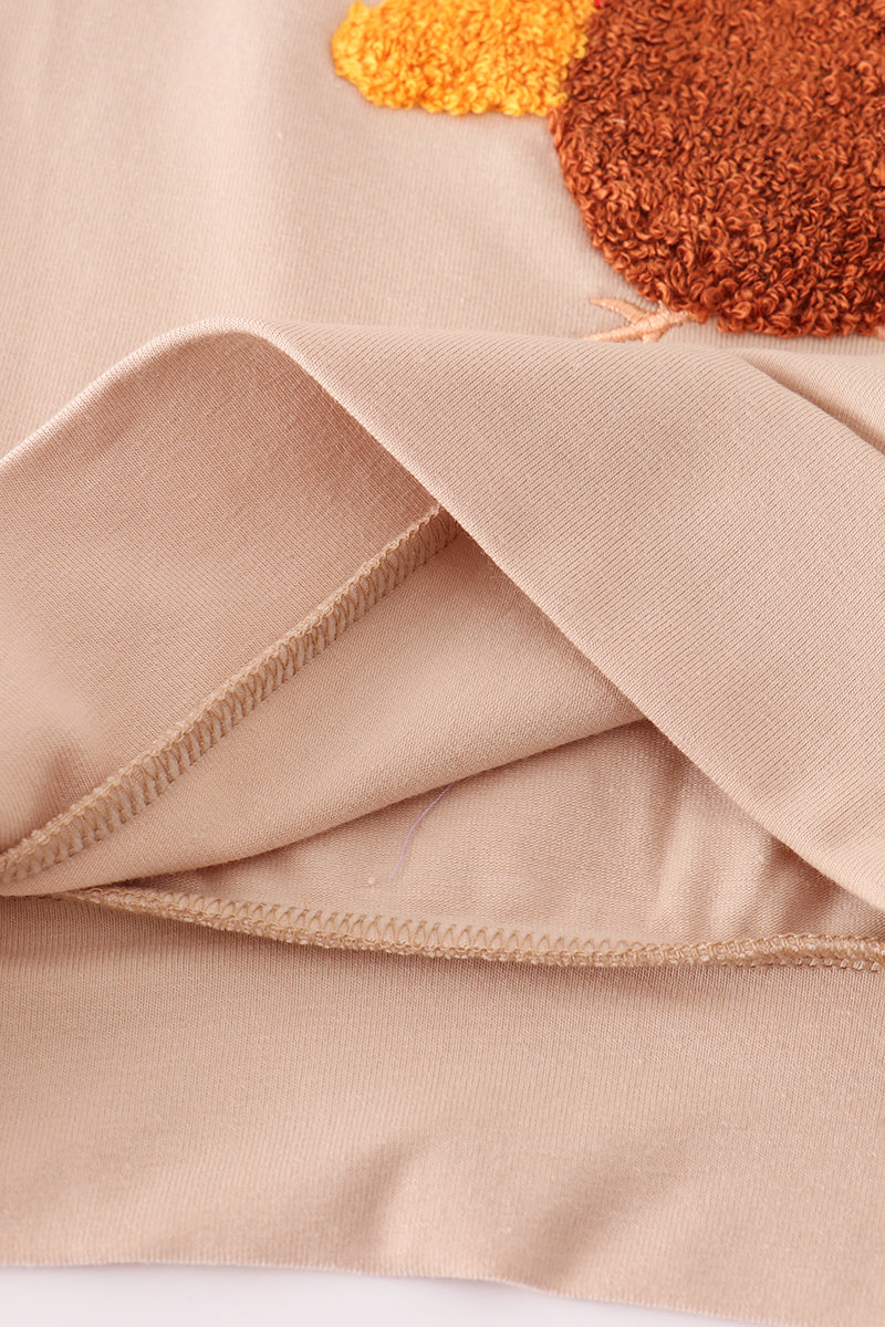 Beige turkey french knot top