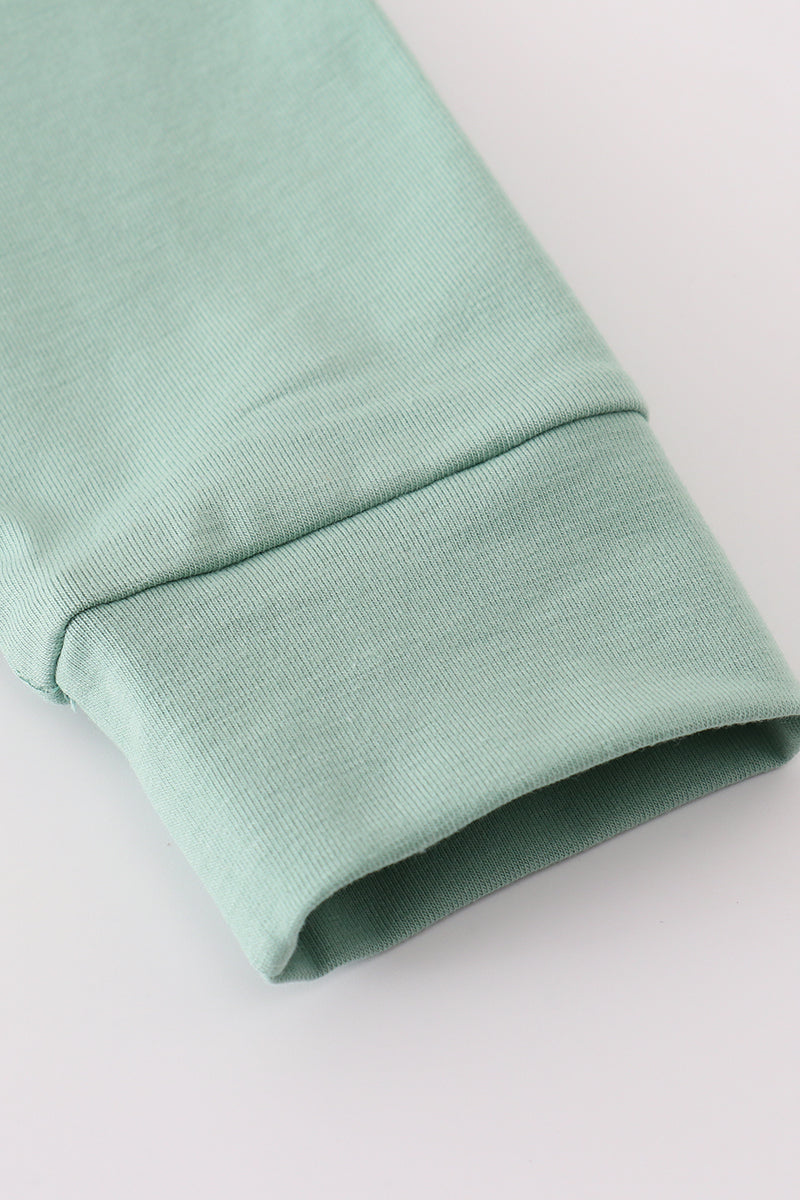 Sage pumpkin french knot ruffle top