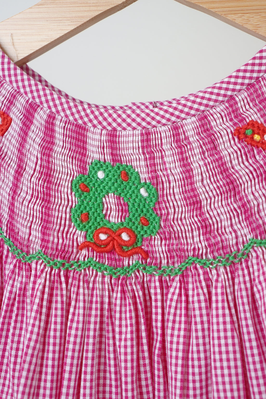 Pink christmas joy hand smocked gingham dress